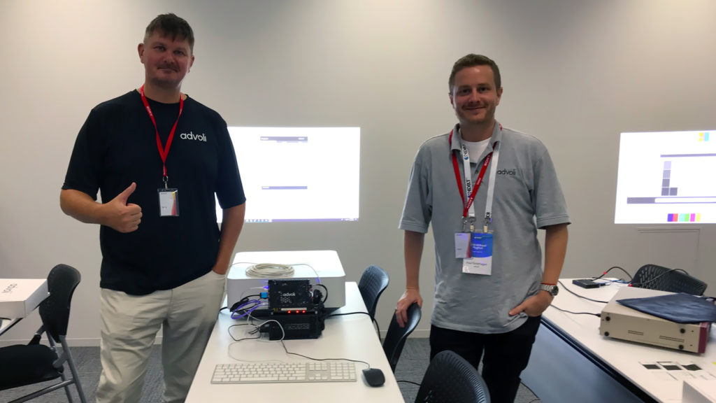 Clas and Paul of advoli posing with TC1 Extreme and Sony Projector using controls over ethernet